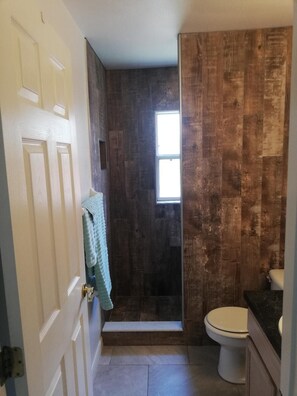 Bathtub, hair dryer, towels, soap