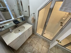 Combined shower/tub, hair dryer, towels, soap