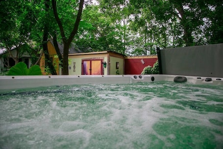 Outdoor spa tub. Private Respite Breathe Deeply Cabin with Garden, SwimSpa/Hot Tub, Fire Pit
