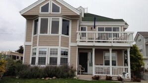 A two-story house with a balcony and a porch. - Gathering Place overlooking beach, pier, and downtown Cayucos (Cayucos)