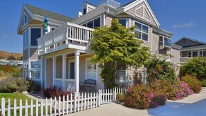 A two-story house with a balcony, a porch, and a white picket fence. - Gathering Place overlooking beach, pier, and downtown Cayucos (Cayucos)