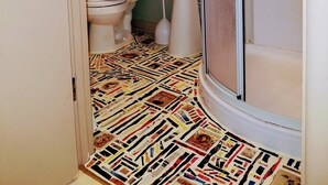A bathroom with a toilet, sink, and shower. - Fully equipped apartment for short term vacation rentals! (Calumet)
