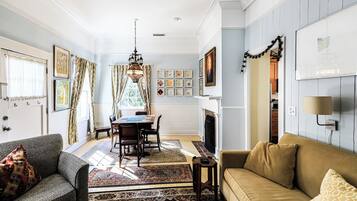 Flat-screen TV, fireplace, DVD player, books