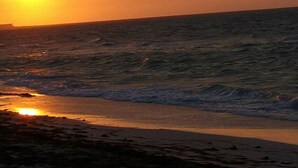 A beach with waves and a sunset. - **New Listing**  Close to the Sea, 2 blocks from the Beach (Chicxulub Puerto)