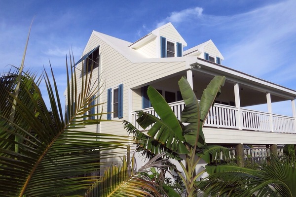The garden is planted with maturing tropical trees and flowers.