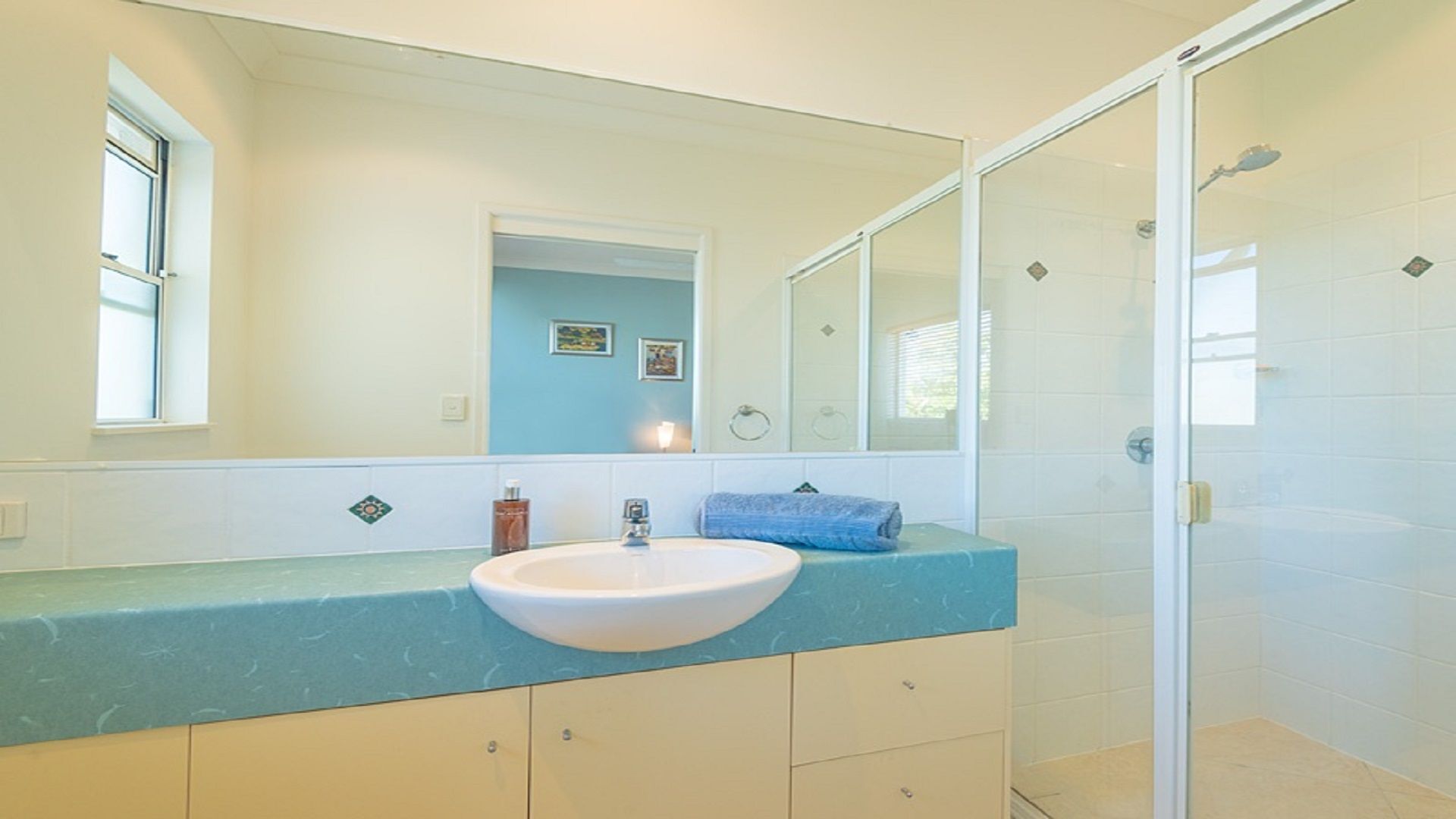 Shower, hair dryer, towels, soap