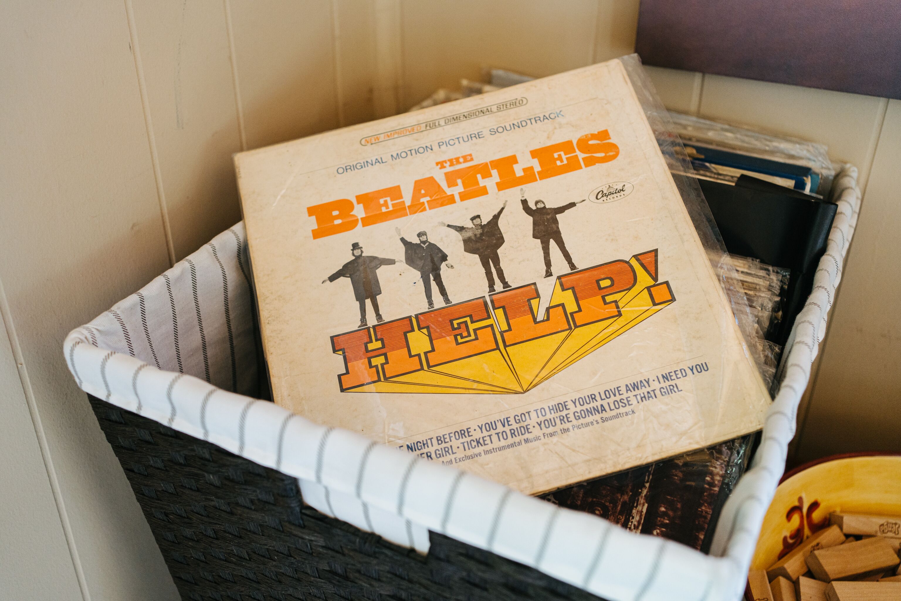 A basket containing a Beatles album cover.
