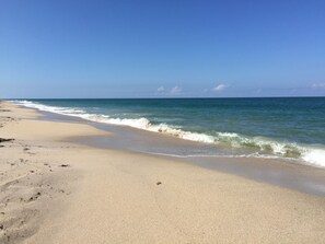 On the beach, sun-loungers, beach towels