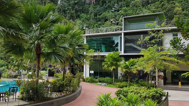 A modern building with a pool and lush greenery. - Prime apartment in Haven Ipoh  (Ipoh)