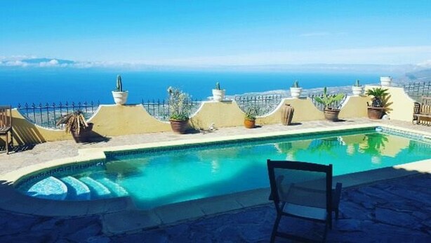 A rooftop pool with a clear view of the ocean. - Adeje Tijoco Alto Overseas Real Estate Villa (Palm-Mar)