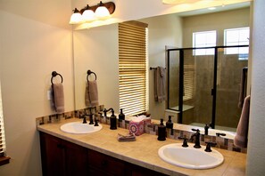 Combined shower/tub, hair dryer, towels, soap