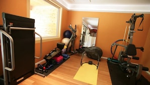 A home gym with exercise equipment, a yoga mat, and a mirror. - ❤️ THE MAGIC TIPI RETREAT (Park Hills)