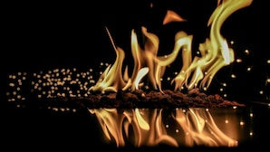 A close-up of a fire with flames and sparks. - ❤️ THE MAGIC TIPI RETREAT (Park Hills)