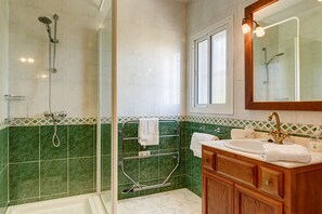 Bathtub, hair dryer, towels, soap