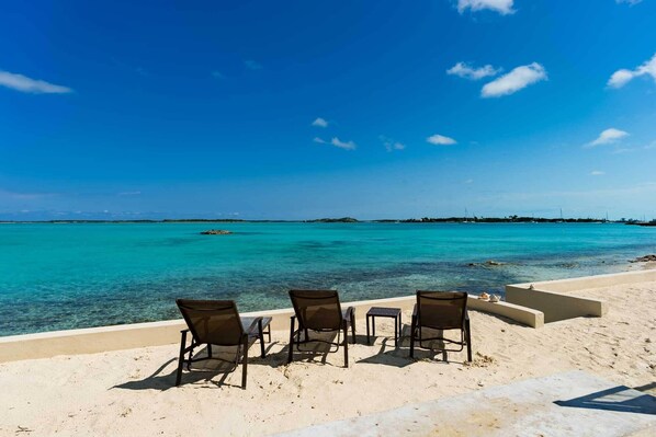 On the beach, sun loungers, beach towels