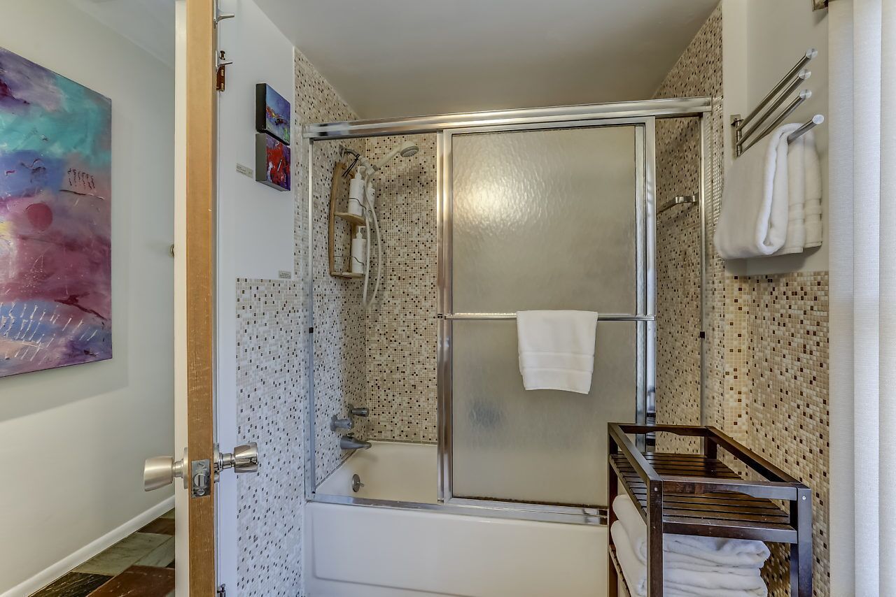 Combined shower/bathtub, hair dryer, towels, soap