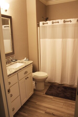 Combined shower/bathtub, hair dryer, towels, soap