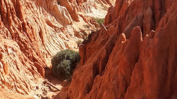 A coastal landscape with red sandstone cliffs and a beach. - Luxury 2 Bed Apartment In 5* Villa Sol Village . (Vilamoura)
