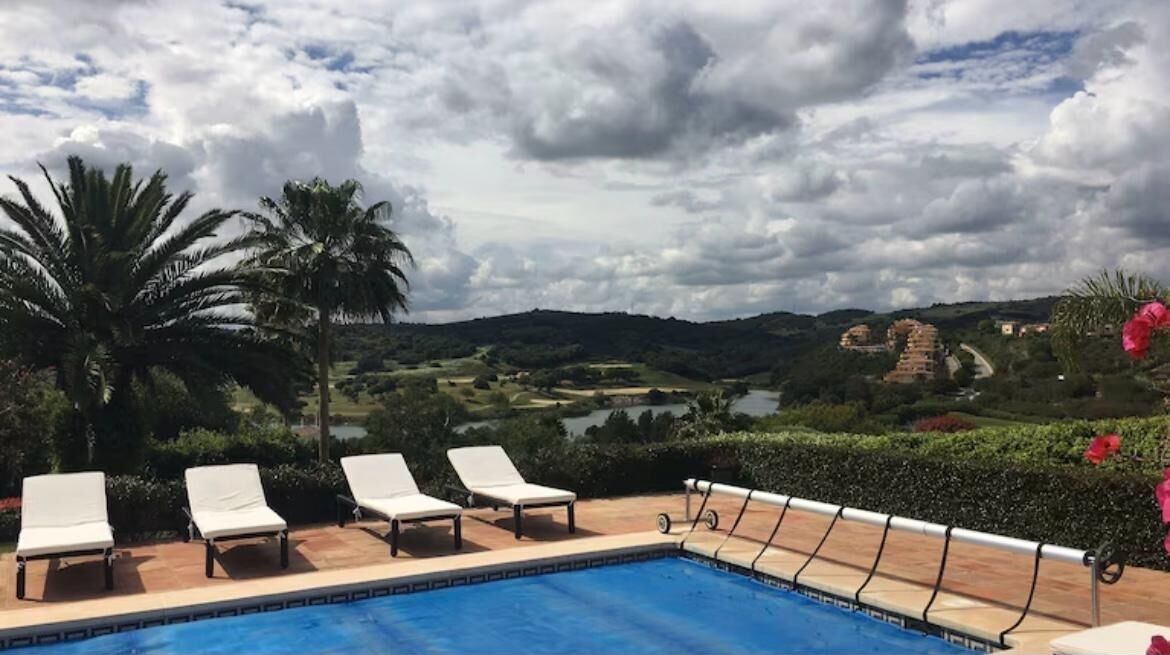 A heated pool, pool loungers