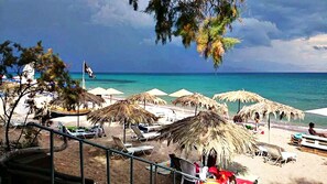 On the beach, sun loungers - Olive Grove stonemade Residency with panoramic view. (Petalidi)