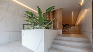 A staircase with marble steps, a planter with plants, wooden slats, and a security camera. - Apartment/ flat - Cullera (Cullera)