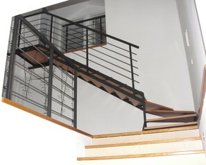 A modern staircase with a metal railing and wooden steps. - Senhora da Graça House - between Fatima and Ourém ** (with swimming pool) ** (Sobral - Ourém)