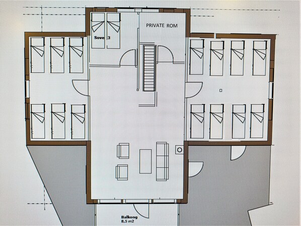 A floor plan of a hotel with a private room, multiple standard rooms, a balcony, and a central area that could be a lobby or common space. - Large family friendly cottage by the sea. New modern cottage with great facilities. (Bergen)