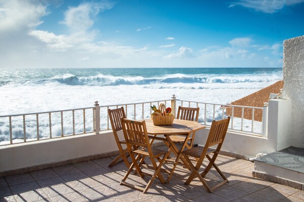 Outdoor dining - Romantic ocean front apartment in a charming fishermen village (Paul do Mar)