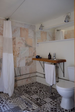 Shower, hair dryer, towels, toilet paper
