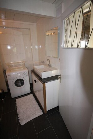 Shower, hair dryer, towels, toilet paper