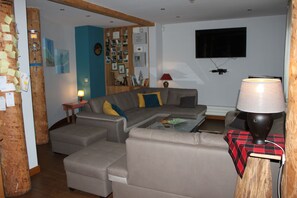 Smart TV, fireplace, table football, books