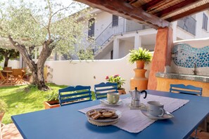 Outdoor dining - House adjacent to playground with ancient olive trees  (Orosei)