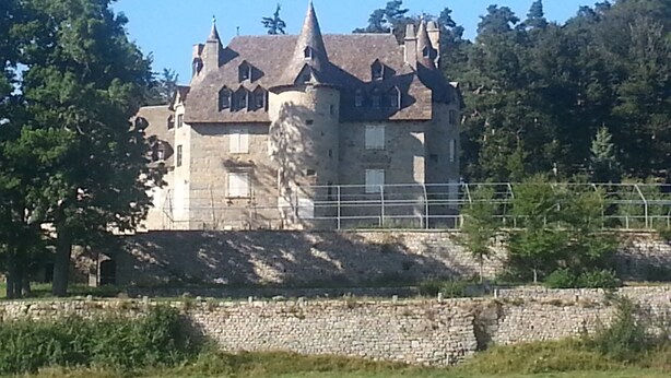 A large, historic stone building with multiple towers and a prominent central tower. - mansion - Fournels (Fournels)