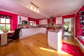 The spacious breakfasting kitchen with Aga and conventional oven.