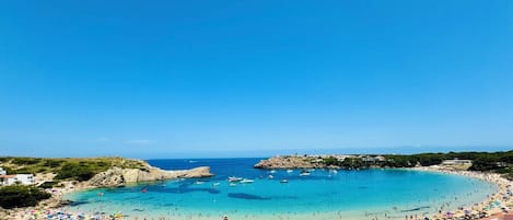 On the beach, sun-loungers, beach towels