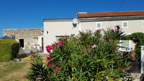 A building with a stone facade and a tiled roof.