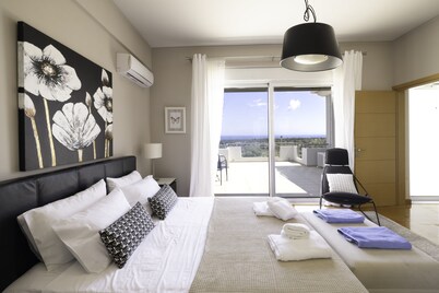 Unique Luxury villa Abelos near Airport and Athens centre, close to sandy Beach.