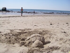 A sandy beach with large sand formations and a clear view of the ocean. - Peaceful & secluded, set in beautiful countryside & only 30 mins from the sea (Caden)