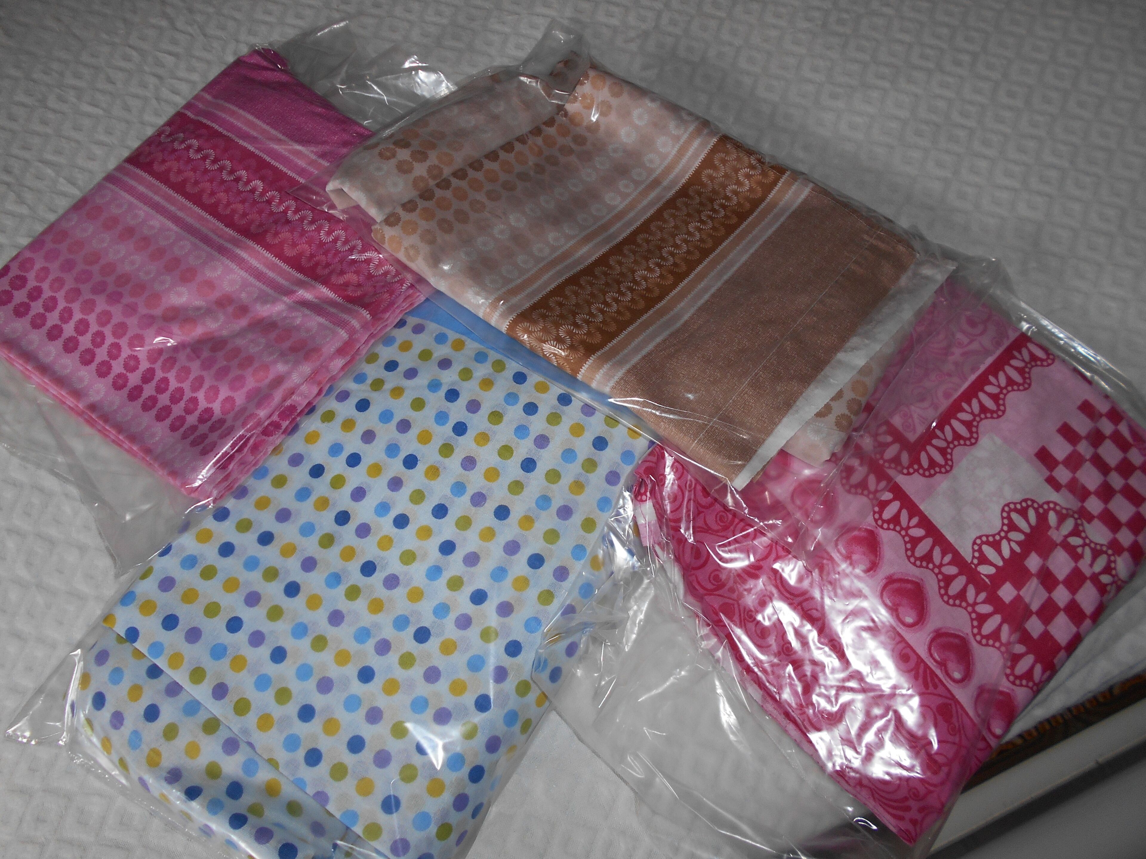 Various fabric swatches in plastic bags.