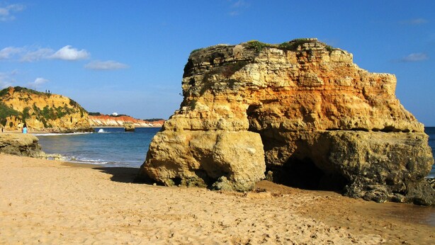 A sandy beach with a prominent rock formation and a clear blue sky. - Lovely 2 bedroom apartment with air con and excellent communal pool & bar (Fonte Santa)