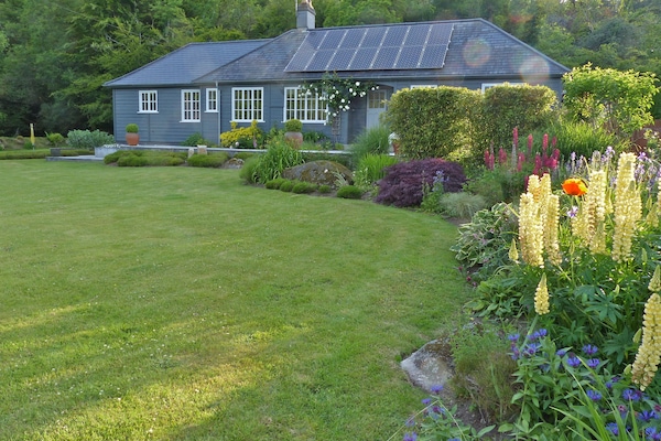 Detached timber framed luxury home on Dartmoor surrounded by large gardens.