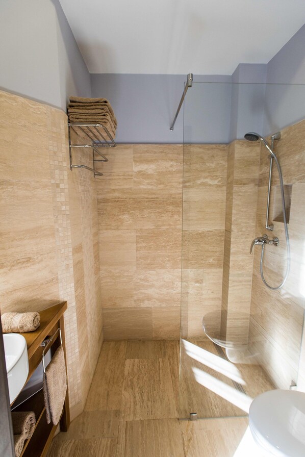 Bathtub, hair dryer, towels, soap