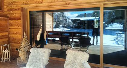 Wooden chalet surrounded by greenery