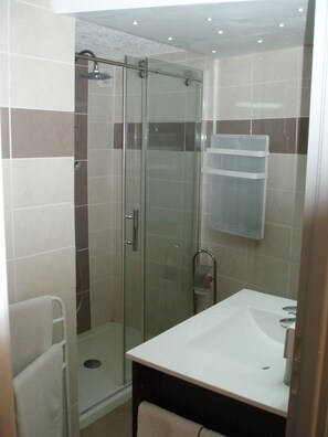 Shower, hair dryer, towels, soap