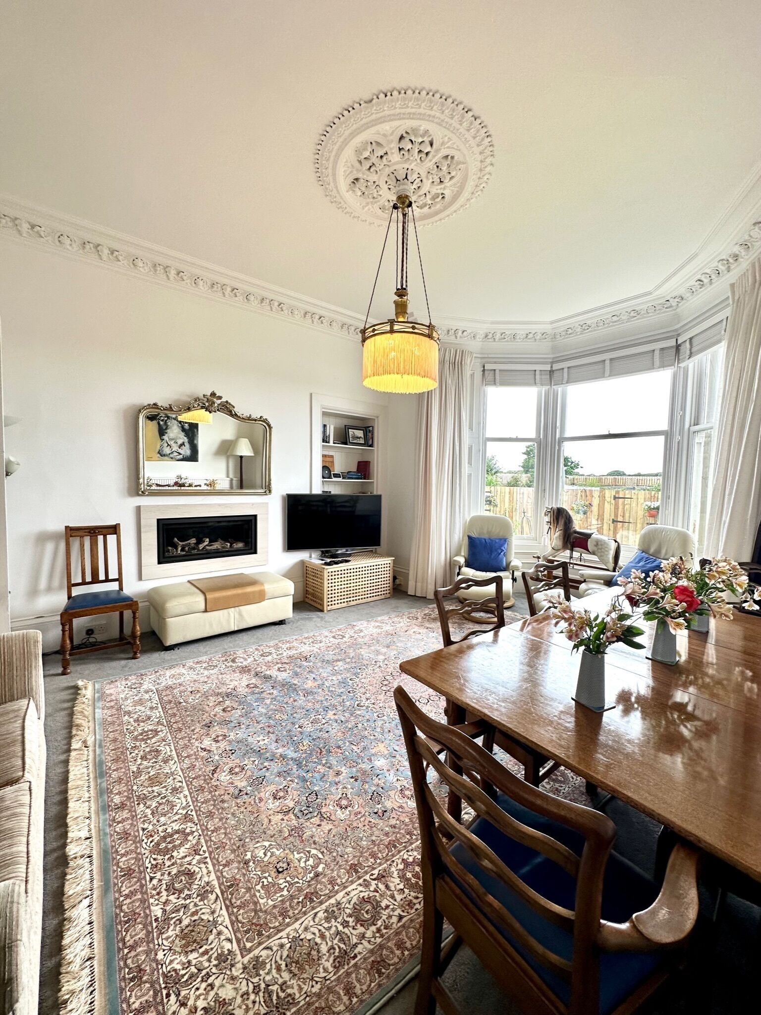 TV, fireplace, books, music library