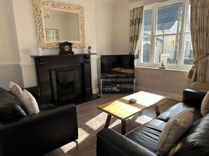 Smart TV, fireplace, DVD player, books