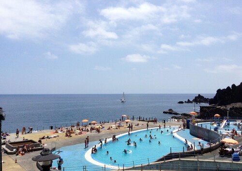 Bright Ocean Front Apartment with large pool in the condominium