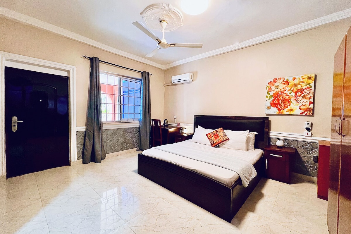 Premium bedding, desk, laptop workspace, blackout curtains