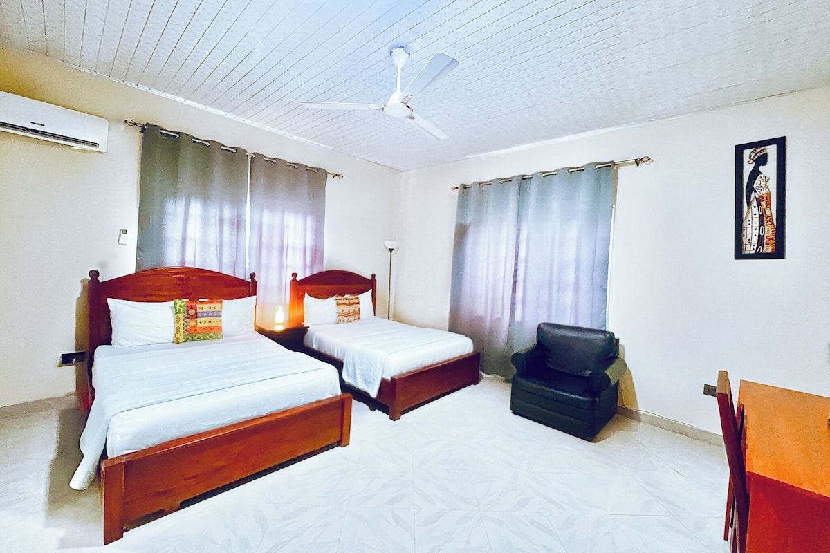 Premium bedding, desk, laptop workspace, blackout curtains