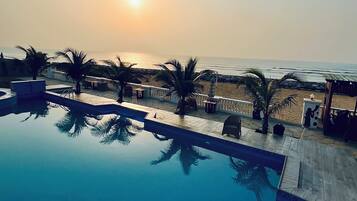 Outdoor pool, pool umbrellas, sun loungers